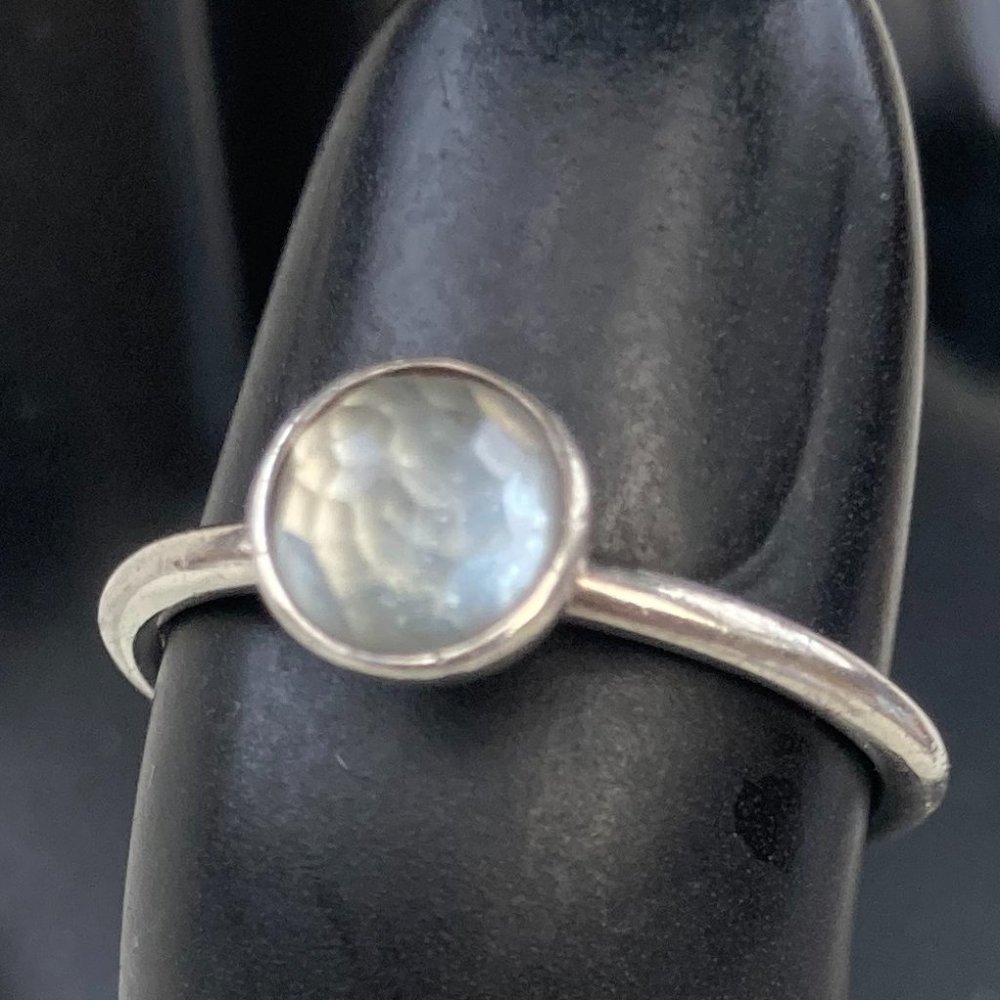 Sterling silver Pandora ring with small blue glass gem